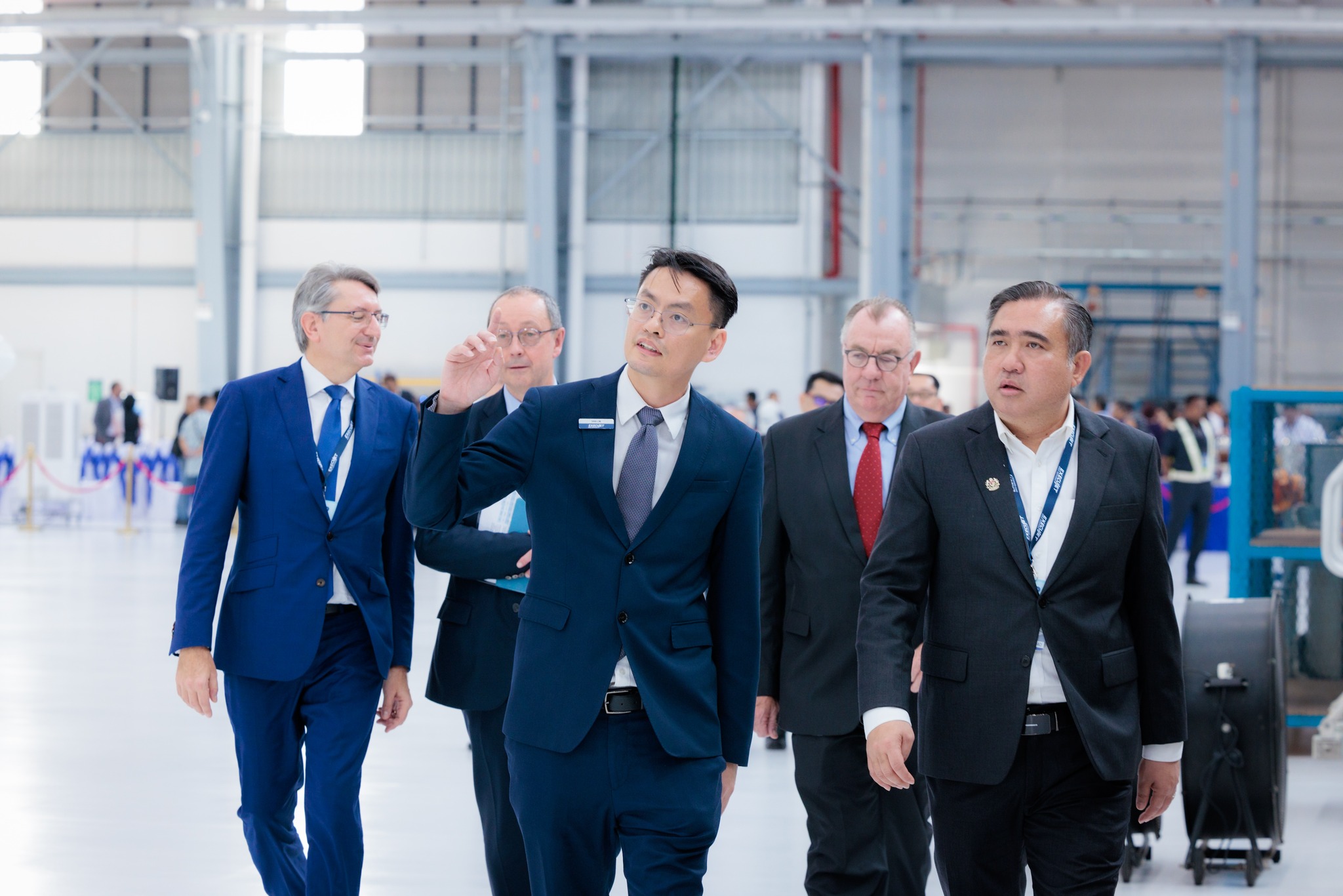 Ivan Lim, Regional VP Asia, ExecuJet MRO Services showing the VIPs the new MRO facility