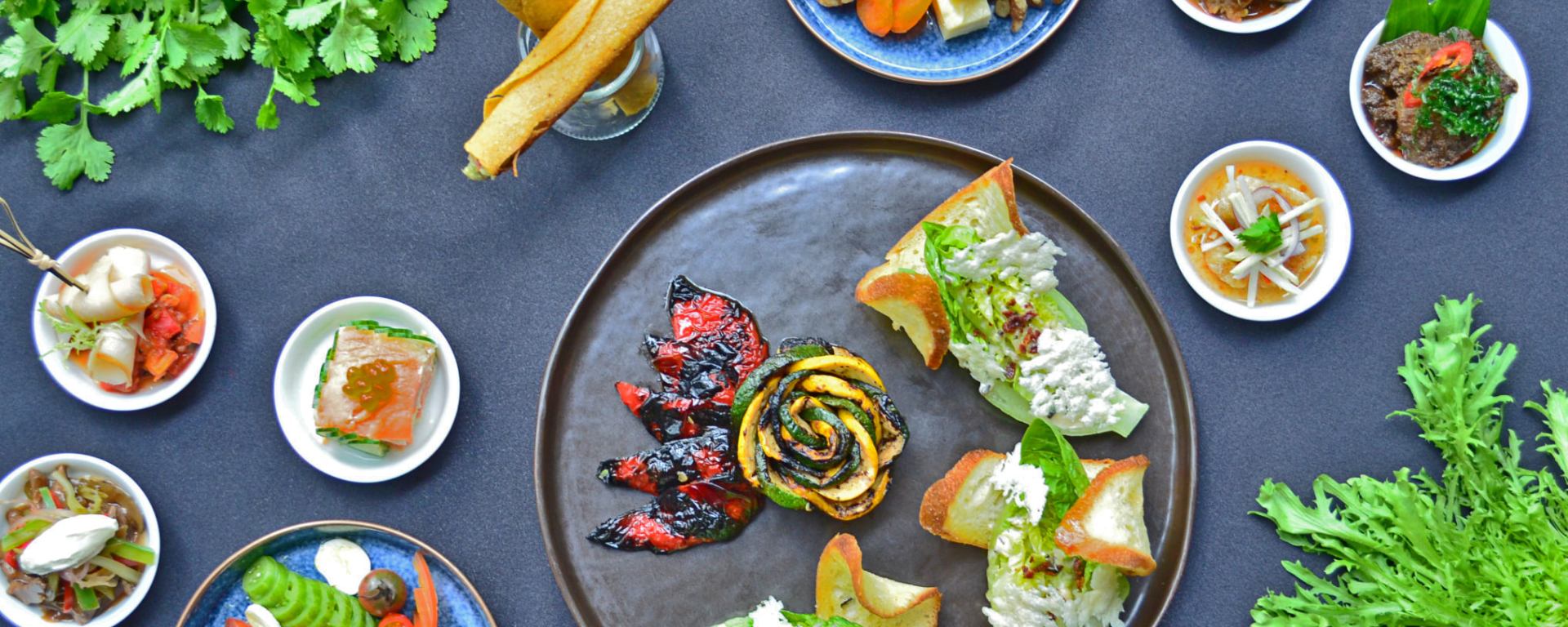 Hickory-Smoked Chicken with Vegetable Ratatouille, Tea Tree-Smoked Norwegian Salmon and Potato Feuille, Artisan Heirloom Tomatoes with Buffalo Mozzarella, Assorted Cheese Platter, Classic Caesar Salad with Condiments, Classic Fillet Stroganoff, Beef Rendang, Fried Seabass with Thai Sauce and Mango Salad